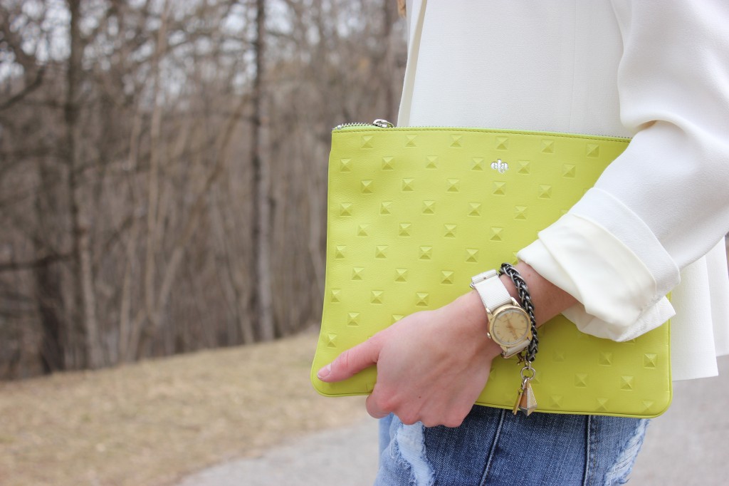 Girl holding green purse. 